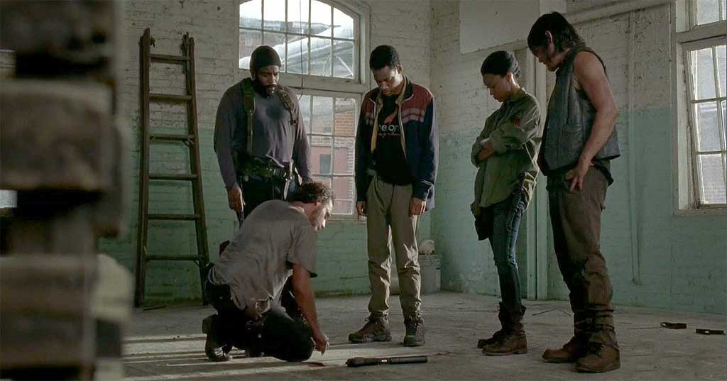 Tyreese, Noah, Sasha and Daryl look on as Rick explains his plan on attacking the Grady hospital.