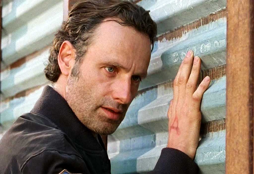 Rick (Andrew Lincoln) monitoring the Alexandria wall for walkers.
