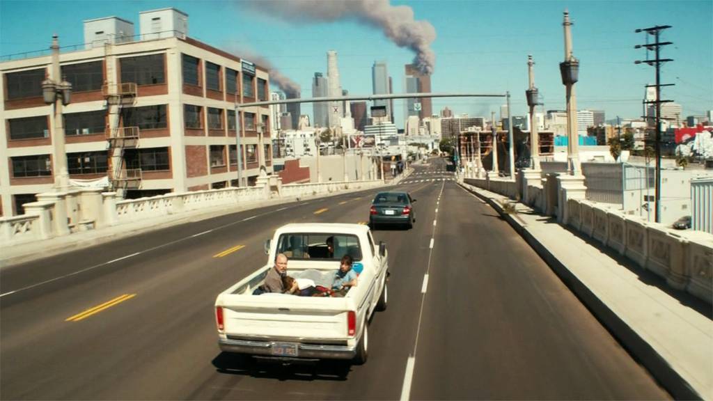 Los Angeles burns in the background as the characters from Fear the Walking Dead drive west.