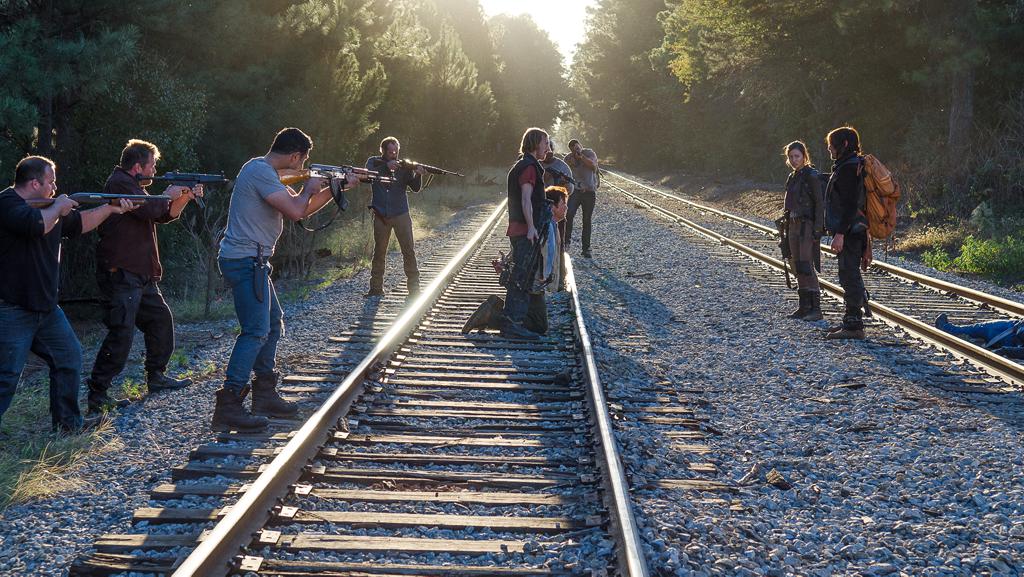 D (Austin Amelio), Eugene Porter (Josh McDermitt), Rosita Espinosa (Christian Serratos) and Daryl Dixon (Norman Reedus). Train tracks are bad luck. Photo by Gene Page/AMC